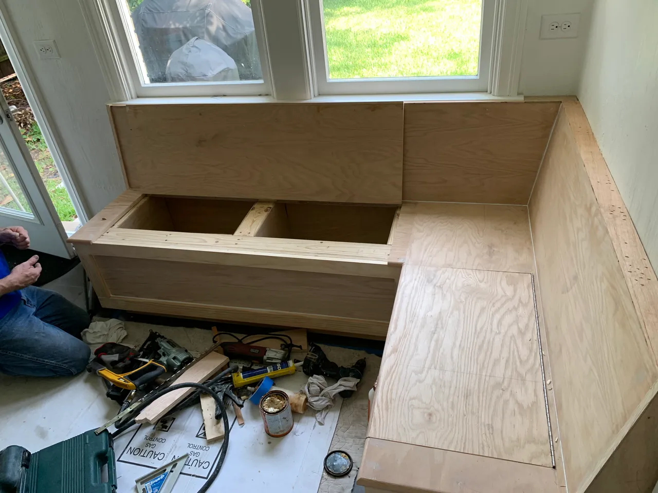 Built-in bench with lift-up storage compartments under the seats, M Streets, Dallas