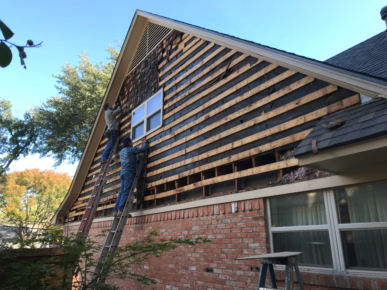 Old siding removed and new furring strips going up before lap siding install in Dallas, TX